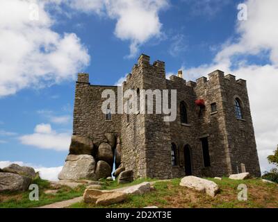 Carn Brea Castle overlooks Redruth from the top of Carn Brea, Cornwall. Stock Photo