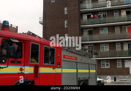 Emergency services attend the scene of a fire, at a third-floor flat in Cable Street, Stepney, east London, today (Friday). Three children and a woman were taken to hospital after being found unconcious in the flat. See PA story FIRE Children. Photo by Derek Cox./PA Stock Photo