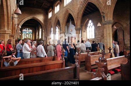 The scene this afternoon as visitors wait to sign 'the book of condolence' (Monday) at The church of Virgin Mary and St. Paul in Gt. Brington near Althorp where Princess Diana will be buried in the family crypt on Saturday.  Stock Photo