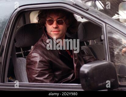 Former Boomtown Rat, Bob Geldof,  leaving his  Chelsea home today (Monday), amid allegations,  made by ex-wife Paula Yates, that he was the cause of her lover Michael Hutchence' death. Hutchence was found hanging in his hotel room in Sydney on Saturday morning. See PA Story DEATH Hutchence. Photo by David Cheskin. Stock Photo
