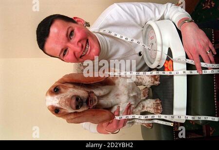 Bumps, a two and a half year old basset hound with his owner Mrs Humphries from County Antrim, Northern Ireland. Bumps shed 6kgs (an incredible 24% of his body weight) to beat off 6 other contestants in the National Pedigree Petfoods Slim Down '97 Championship which took place in Grantham, Lincolnshire yesterday (Saturday). PA Photos Stock Photo