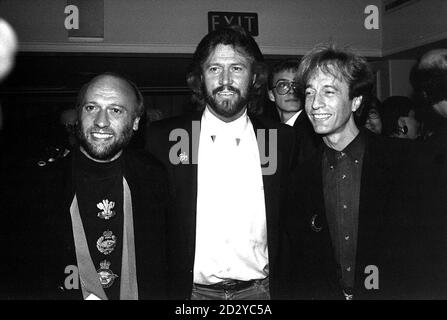 BRITISH POP TRIO THE BEE GEES. THE GIBB BROTHERS BARRY (CENTRE) AND TWINS MAURICE (LEFT) AND ROBIN (RIGHT) 27/9/99 to be honoured with a collection of stamps which are to be issued by the island of their birth  where their mother once ran a Post Office. I ve Gotta Get A Message To You is aptly one of the global hits commemorated on the set of Isle Of Man stamps to be issued on October 12. All but the youngest musical brother Andy were born on the Isle of Man, and eldest brother Barry was nine by the time the family moved to Manchester in 1955. Stock Photo
