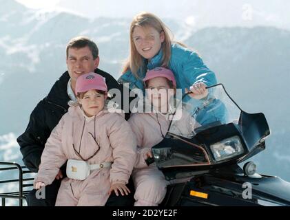 The Duchess of York with former husband the Duke of York,   during a photocall with their daughters Princesses Beatrice (right), nine, and seven-year-old Eugenie in Verbier, Switzerland today (Thursday).  PA PIC NEIL MUNNS.  See PA Story ROYAL Duchess.  07/03/98: The Princesses could be stripped of their HRH titles in a round of reforms to further modernise the monarchy, announced today (Saturday).  The proposals include restricting the style His or Her Royal Highness to senior royals; confirming that bowing and curtseying to royals is not compulsory; and finally closing the door on palace gra
