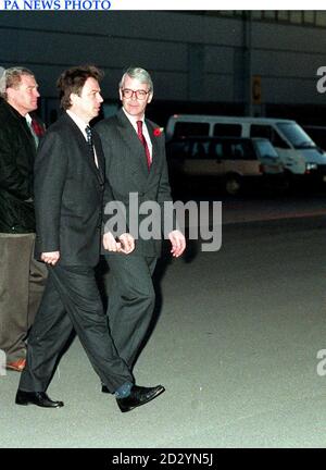 Prime Minister John Major leads Tony Blair to the plane at RAF Northholt, heading to Israel with Paddy Ashdown for the funeral of Yitzhak Rabin. Stock Photo