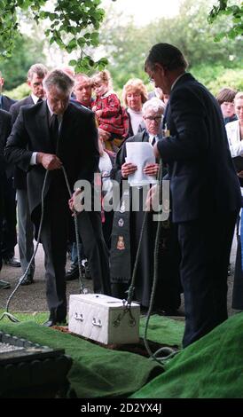 The coffin bearing the body of abandoned baby Callum's who was found strangled to death shortly after being born is lowered into a a grave after a funeral service St Elphin's parish church, Warrington today (Monday). Around 150 mourners attended the funeral of Callum, named after the Callands area of Warrington, Cheshire. See PA Story FUNERAL Callum. Liverpool Daily Post POOL Photo PA. Stock Photo