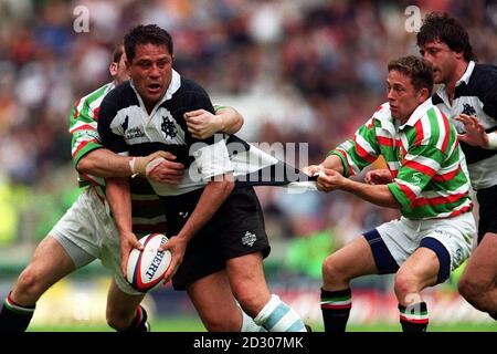 Barbarians World XV Zinzan Brooke (with ball) gets his shirt pulled by Jamie Hamilton during their clash against Leicester Tigers for the Scottish Amicable Trophy at Twickenham in London today (Sunday 23rd May 1999). Final score Barbarians 55, Tigers 33. Stock Photo