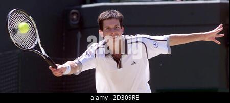 No Commercial Use: British tennis star Tim Henman in action during his quarter final match against Cedric Pioline of France at Wimbledon. Stock Photo