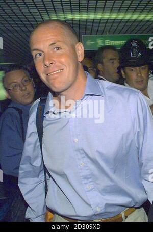 Rogue trader Nick Leeson, who brought down Barings Bank,  makes his way to a news conference at London's Heathrow airport the day after Leeson was released from a Singapore jail. Stock Photo