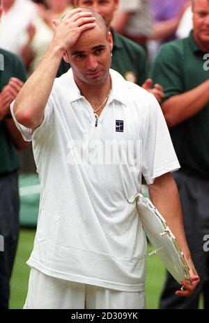 No Commercial Use : America's Andre Agassi looks distraught after losing the Men's Singles final to fellow American Pete Sampras at Wimbledon. Sampras defeated Agassi 6-3 6-4 7-5. Stock Photo