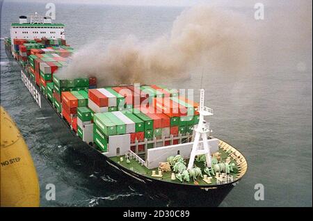 The container ship Ever Decent on fire in the English Channel off the Kent coast  after it had been in collsion with the cruise liner Norwegian Dream.    *  Three people were injured in the collision, and some of the containers fell from the ship onto the bow on the liner which has now docked in Dover. Stock Photo