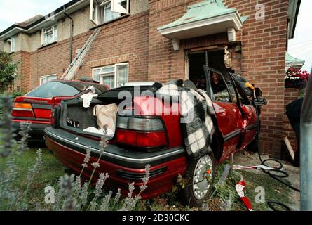 Building experts check the property in Downland Drive after a car containing three elderly women ploughed through the front door of a flat. Emergency services were alerted after the automatic Rover crashed into a parked car. * It then crushed the second vehicle into the wall beneath a first-floor window, the Rover embedded itself in the front door, where it ground to a halt. Firefighters cut the driver and front-seat passenger free from the wreckage, and all three women in the Rover were taken by ambulance to Brighton s Royal Sussex County Hospital. The pensioners are thought to have suffere Stock Photo