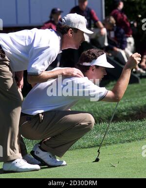 European Ryder Cup player Miguel Angel Jimenez puts his hand on the shoulder of Padraig Harrington, during their foursomes match against America at The Country Club, Brookline, Massachusetts. Stock Photo