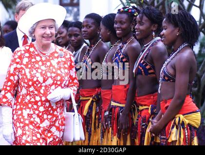 The Queen is welcomed by traditional Mozambican dancers at the Polana ...
