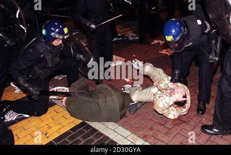 Riot police officers clash with demonstrators at Euston, as a peaceful protest by anti-capitalist campaigners turned sour, resulting in violent confrontation. Stock Photo