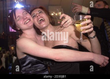 Party goers celebrate the year 2000 at the Millennium Dome in Greenwich, south east London. Stock Photo
