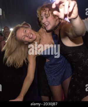Party goers celebrate the year 2000 at the Millennium Dome in Greenwich, south east London. Stock Photo