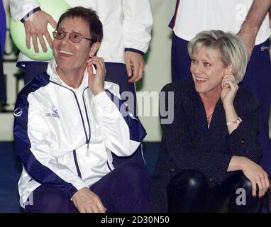 Singer Sir Cliff Richard,  and former British tennis star and television sports presenter Sue Barker, at The London Arena in Docklands, for the York tennis challenge cup for the charity Children in Crisis.