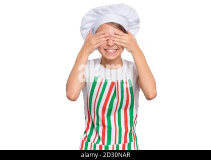 Cute girl in chef uniform isolated on white background covering eyes with hands Stock Photo