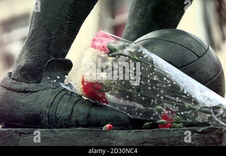 Flowers are laid in tribute to Sir Stanley Matthews, at the feet of a statue of the star at the Potteries shopping centre in Hanley, Stoke-on-Trent.  The former Blackpool and Stoke City winger died aged 85,  after a short illness. Stock Photo