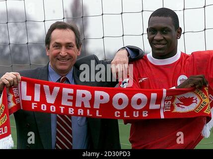 This picture can only be used within the context of an editorial feature. Liverpool FC manager Gerard Houllier (left) smiles for the cameras with new striker Emile Heskey, who has joined the club from Leicester for   11 million.   *  Heskey declared:  I have come here to produce the goods. Stock Photo
