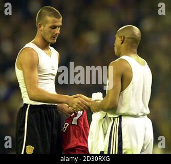 Manchester United's David Beckham (left) shakes hands with Real Madrid's Roberto Carlos, after their Champions League Quarter Final match at Santiago Bernabeu Stadium. Stock Photo