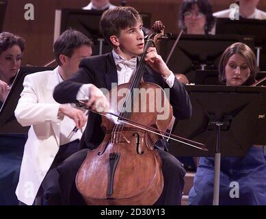 18 year old Guy Johnston plays his Cello on the way to winning the BBC Young Musician of the Year 2000 competition, at the Bridgewater Hall in Manchester. One of Guy's strings broke at the start of his performance but he managed to keep his composure. * ...changing the string and carrying on to win. Stock Photo
