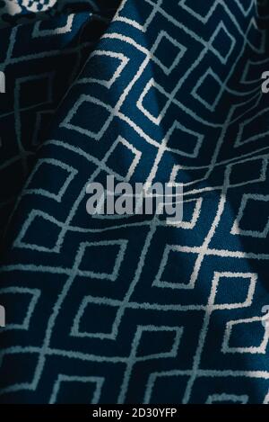 material textile background. Blue fabric in diamonds. Close-up of the white blue diamond shaped fabric textile texture Stock Photo