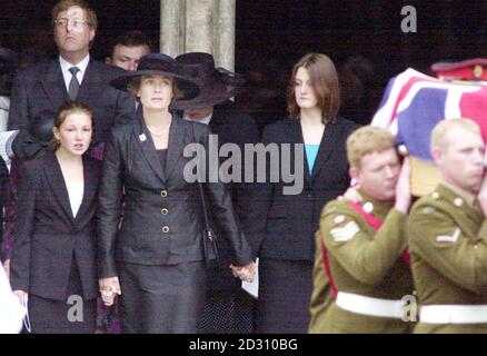 The coffin of Brigadier Stephen Saunders leaves Salisbury Cathedral followed by his widow Heather and daughters Catherine, 13 (L) and Nicola, 15. The defence attache was shot dead by terrorists in Athens on 8/6/00 while driving to work at the British Embassy. Stock Photo