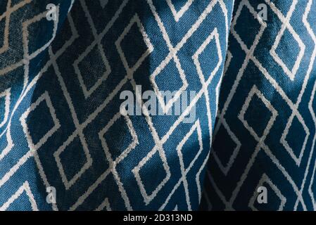 material textile background. Blue fabric in diamonds. Close-up of the white blue diamond shaped fabric textile texture Stock Photo