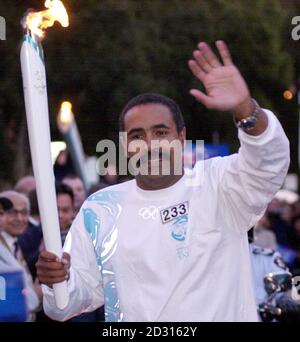 Double Olympic gold medalist Daley Thompson carries the Olympic Torch through the streets of Parramatta, Sydney, Australia, ahead of the opening ceremony of the 2000 Olympic Games. Stock Photo