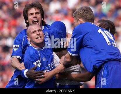 THIS PICTURE CAN ONLY BE USED WITHIN THE CONTEXT OF AN EDITORIAL FEATURE. NO WEBSITE/INTERNET USE UNLESS SITE IS REGISTERED WITH FOOTBALL ASSOCIATION PREMIER LEAGUE. Gianfranco Zola, Jody Morris, front left, and Tore Andre Flo, right congratulate Jimmy Floyd Hasselbaink, centre, after he gave his side the lead against Manchester United at Old Trafford. Stock Photo