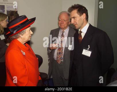 The Queen meets actor Ralph Fiennes at the opening of the new premises of the Royal Academy of Dramatic Art in London. During the visit, the Queen, accompanied by Lord Attenborough, met students and celebrities linked to the academy. Stock Photo