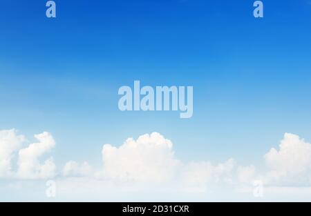 Blue sky background with white tiny clouds. Blue and white pastel heaven background. Stock Photo
