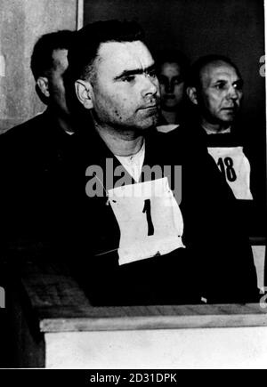 1945:  Josef Kramer, known as 'The Beast of Belsen', in the dock during his trial at Luneberg, Germany, for crimes committed during his time as Commandant of Belsen concentration camp, near Hamburg. Kramer was sentenced to death on the 17th November 1945. Picture part of PA Second World War collection.  Stock Photo