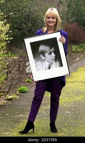 Fomer model Twiggy with an old photograph of herself by Barry Lategan at a special reception, in central London, where she was honoured by Cosmetic Executive Women UK. Stock Photo