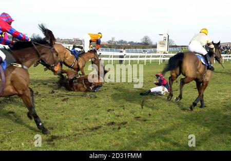 Comex Flyer and jockey Liam Cooper (centre on ground) fall after jumping  the last hurdle, during the Alphameric Betting Display Systems Novices'  Hurdle at Sedgefield Stock Photo - Alamy