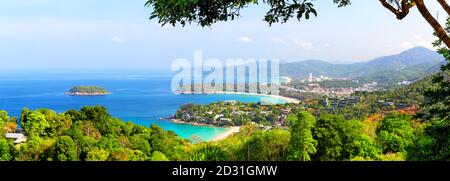 Panoramic view of Karon Beach, Kata Beach and Kata Noi in Phuket, Thailand. Beautiful turquoise sea and blue sky from high view point. Panorama of tra Stock Photo