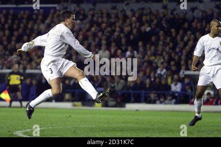 THIS PICTURE CAN ONLY BE USED WITHIN THE CONTEXT OF AN EDITORIAL FEATURE. NO WEBSITE/INTERNET USE UNLESS SITE IS REGISTERED WITH FOOTBALL ASSOCIATION PREMIER LEAGUE. Leeds United's Ian Harte (left) scores a goal against Deportivo La Coruna, during their UEFA Champions League Quarter Final first leg football match at Elland Road, in Leeds. Stock Photo