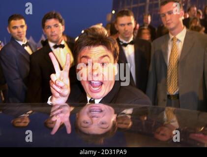 Mike Myers gets in a car after attending the premiere of 'Shrek', in which he does a voice part, screening in Cannes. Stock Photo