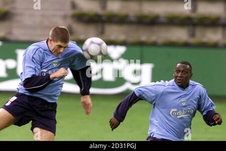 liverpools midfielder steven gerrard left heads the ball as team mate emile heskey watches on during a training session at the westfalen stadium dortmund liverpool play spains cd alaves in the uefa cup final on wednesday at the westfalen stadium 2d31pgj
