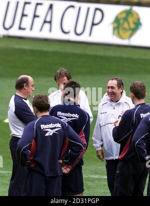 Liverpool's manager Gerard Houllier (second right) smiles with his team members during a training session at the Westfalen Stadium, Dortmund. Liverpool play Spain's CD Alaves in the UEFA Cup Final on 16/5/01. Stock Photo