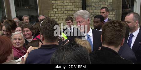 Former American President Bill Clinton greets wellwishers as he leaves the Randolph Hotel in Oxford.  Later in the day Mr Clinton, who studied politics at University College as a Rhodes Scholar was due to officially open the Rothermere American Institute.   Stock Photo
