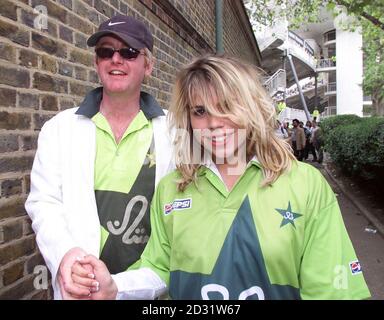 Virgin Radio DJ Chris Evans and his new wife Billie Piper, both wearing swapped Pakistan shirts they received from Pakistan fans sitting with them in the stands, at Lords during The NatWest Series at Lord's, London. Stock Photo