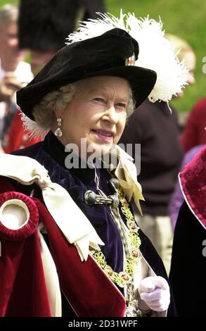 HM Queen Elizabeth II wearing her Order of the Garter robes, makes her way to St George's Chapel Windsor, for the annual Garter Ceremony. Stock Photo