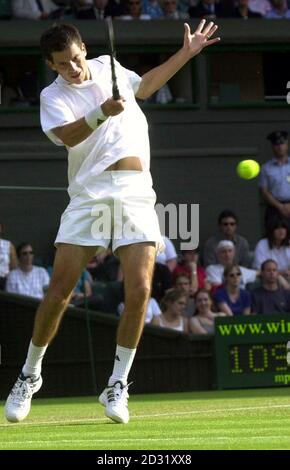 NO COMMERCIAL USE : Great Britain's Tim Henman in action against fellow countryman Martin Lee during the Second Round match of the 2001 Lawn Tennis Championships at Wimbledon, London. Stock Photo