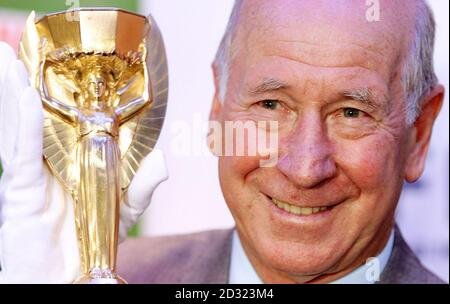 Sir Bobby Charlton one of England's 1966 winning heroes unveiled a replica of the World Cup trophy for the first time since it was commissioned. Sir Bobby,was presented with the 254,000 Jules Rimet trophy, at the National Football Museum, in Preston. * The trophy was ordered by the Football Association after the original was stolen three months before the tournament began, it was eventually discovered by a man out walking his dog and placed in a vault of a London jewellers until the final on July 30. But not since the players celebrated on the pitch at Wembley stadium, London, after being p Stock Photo
