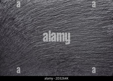 Dark grey black slate background or texture. Empty black stone background. Top view. Free copy space. Stock Photo