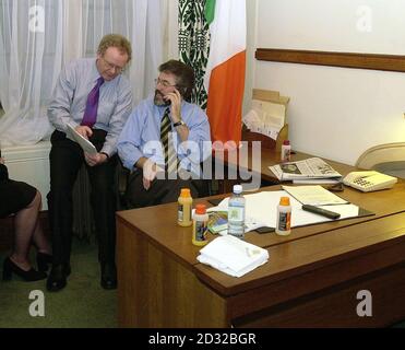 Sinn Fein's Martin McGuinness (left) and Gerry Adams talk inside Gerry Adams' office at the House of Commons, London, on the day that the two, along with the party's two other Westminster MPs, Pat Doherty and Michelle Gildernew took up their office spaces.  *   for the first time. Sinn Fein president Gerry Adams urged Prime Minister Tony Blair to face up to the threat to the Northern Ireland peace process from a loyalist killing campaign during talks at No. 10. Stock Photo