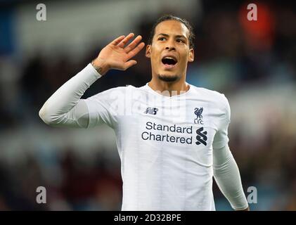 Liverpool's Virgil Van Dijk cups his ear to the Liverpool fans after the game as they celebrate victory. Picture Credit : © MARK PAIN / ALAMY Stock Photo