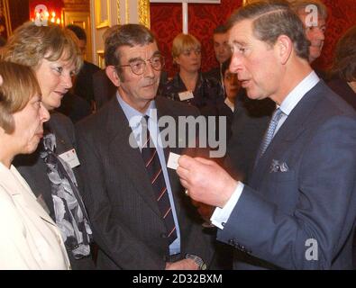 The Prince of Wales meets, (2nd and 3rd left), Graham and Patricia Brazil, from Exeter at a reception for farming families and communities at St James' Palace, London, today. Stock Photo